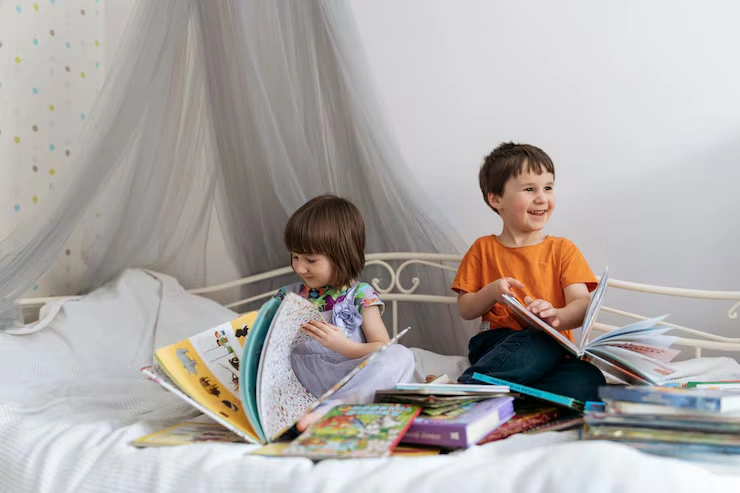 two kids reading books bed laughing 1048944 15896112